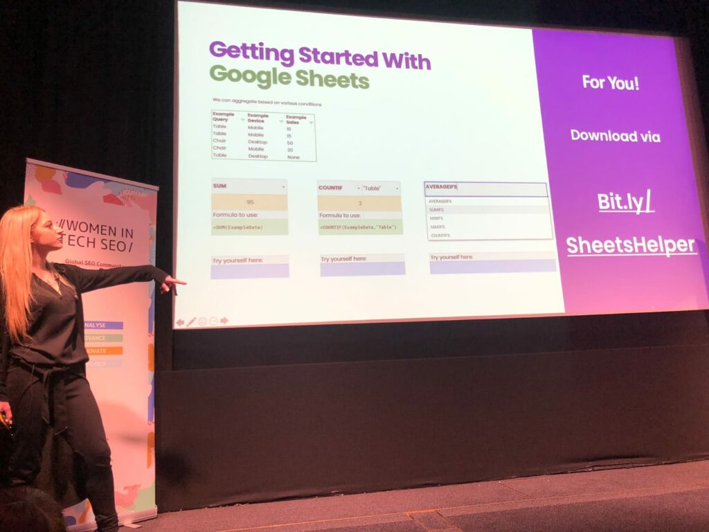 Hannah Rampton, on stage at women in tech seo fest