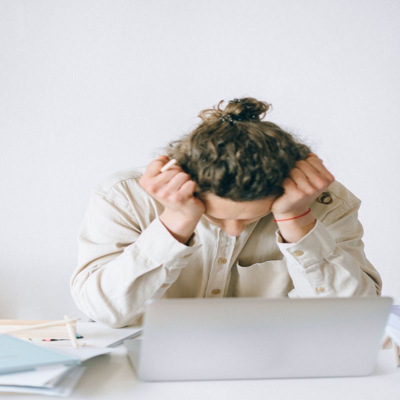 Man looking frustrated at computer