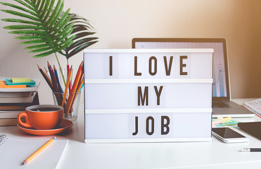 I love my job concepts with text on light box on desk table in home office.Business motivation or inspiration,performance of human concepts ideas