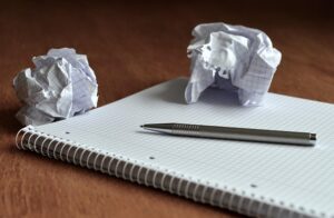 old school screwed up paper and pen for writing notes